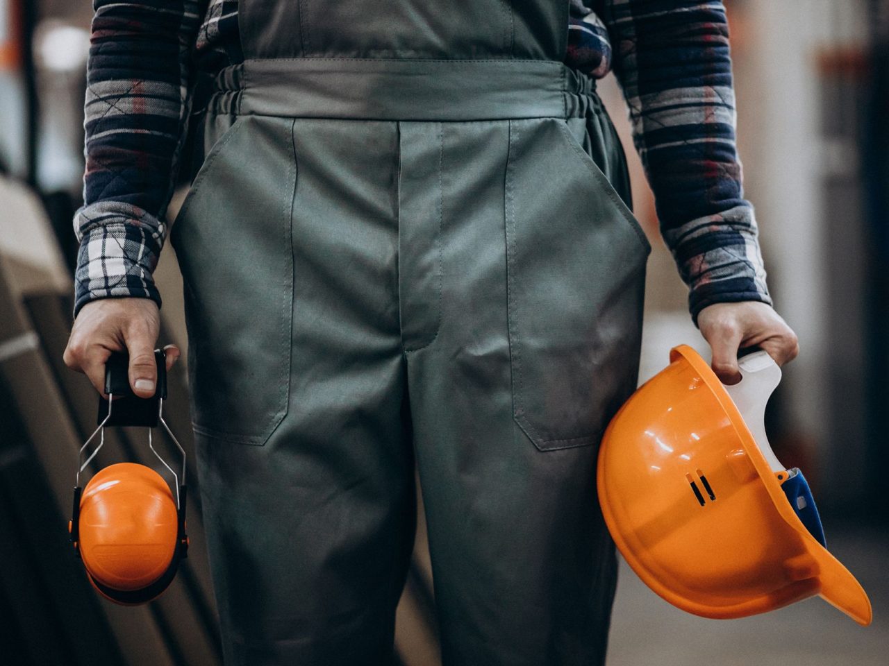 young-male-handyman-with-safety-earphones